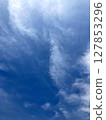 Looking up at the blue spring sky with clouds spreading 127853296