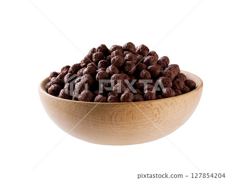 wooden bowl of tasty chocolate corn balls isolated on a white background. 127854204