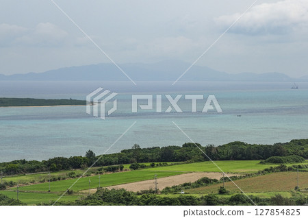 Ishigaki Island as seen from Nishi-Odake Observatory on Kohama Island Ishigaki Island as seen from Nishi-Odake Observatory on Kohama Island 127854825