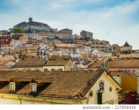 Coimbra with historic architecture, red tiled roofs and the university on the hilltop, Portugal Coimbra with historic architecture, red tiled roofs and the university on the hilltop, Portugal 127856416