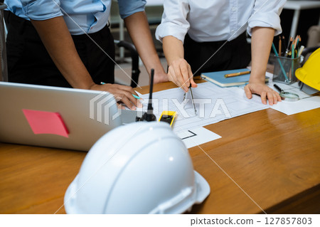 architect or engineer team working on table use drawing tool on the paper plan for business architectural project. 127857803