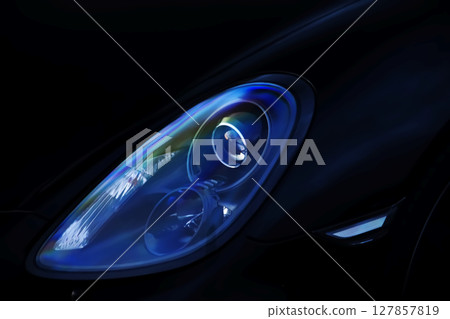 Black sports car headlights 127857819