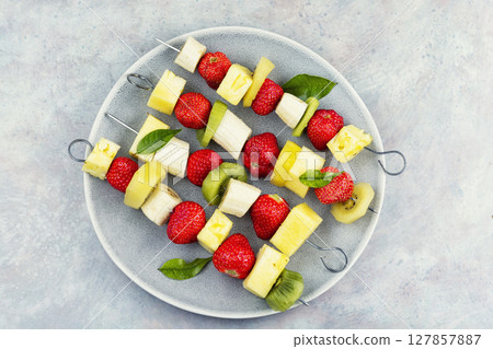 Homemade fruit rainbow kebab. 127857887