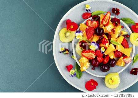Appetizing summer fruit salad. Appetizing summer fruit salad. 127857892