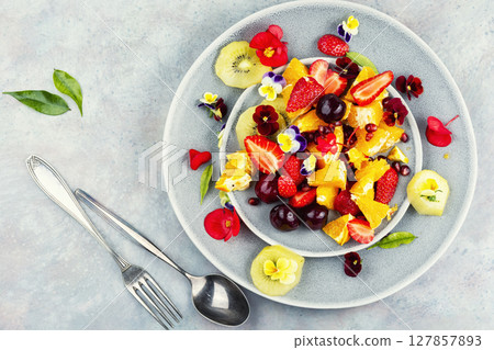 Plate of fresh fruit salad, healthy summer meal. 127857893
