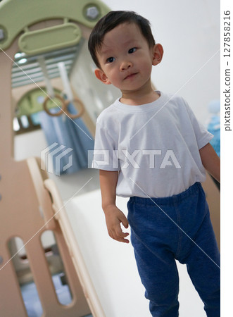Little Asian Boy Climbs Slide Little Asian Boy Climbs Slide 127858216