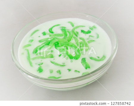 Thai dessert, Green jelly noodle made from rice in sweet coconut milk Thai dessert, Green jelly noodle made from rice in sweet coconut milk 127858742