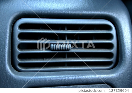 A retro car air vent in close up view. A retro car air vent in close up view. 127859604