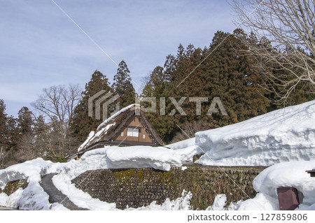Old houses in Shirakawa-go, Gifu Prefecture in early spring 127859806