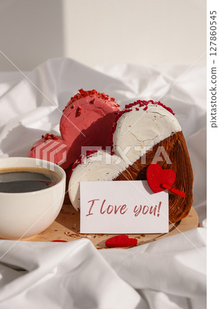 I LOVE YOU text message paper note card Morning breakfast Valentine's Day Birthday celebration Delicious fresh variety croissants topped with colorful flavor Ganache. Creation unique heart shape I LOVE YOU text message paper note card Morning breakfast Valentine's Day Birthday celebration Delicious fresh variety croissants topped with colorful flavor Ganache. Creation unique heart shape 127860545
