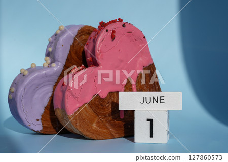 Children's day 1 June wooden calendar cubes wishes greeting holiday card Heartshaped pastry croissant treat topped with colorful frosting galore. Food experimentation viral dessert baking trend Children's day 1 June wooden calendar cubes wishes greeting holiday card Heartshaped pastry croissant treat topped with colorful frosting galore. Food experimentation viral dessert baking trend 127860573