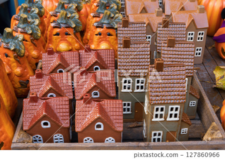 Halloween souvenirs and funny pumpkins and houses in a small shop Halloween souvenirs and funny pumpkins and houses in a small shop 127860966