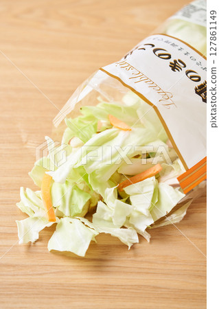 Open bag of cut vegetables (cabbage, mushrooms, carrots) Open bag of cut vegetables (cabbage, mushrooms, carrots) 127861149