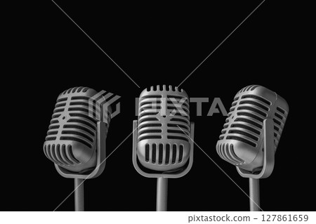 Set of vintage silver microphones with a black background Set of vintage silver microphones with a black background 127861659