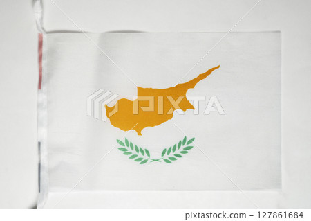 Closeup view of the Cyprus national flag isolated over a white background. Concept of government and nationality Closeup view of the Cyprus national flag isolated over a white background. Concept of government and nationality 127861684