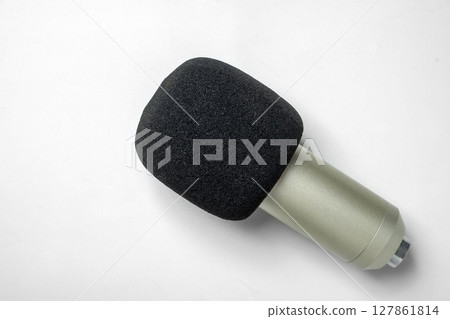 Studio microphone for podcasting or streaming on a white background. Top view Studio microphone for podcasting or streaming on a white background. Top view 127861814