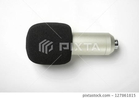 Studio microphone for podcasting or streaming on a white background. Top view 127861815