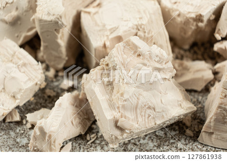 Compressed fresh yeast cubes close-up Compressed fresh yeast cubes close-up 127861938