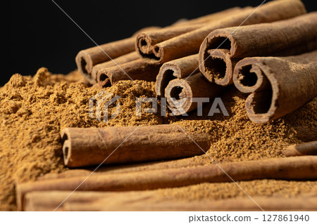 Cassia Cinnamon Sticks and Ground Spice Close-Up 127861940