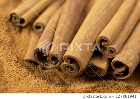 Cassia Cinnamon Sticks and Ground Spice Close-Up Cassia Cinnamon Sticks and Ground Spice Close-Up 127861941