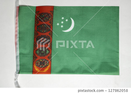 Closeup view of the Turkmenistan national flag isolated over a white background. Concept of government and nationality 127862058