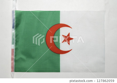 Closeup view of the Algeria national flag isolated over a white background. Concept of government and nationality 127862059