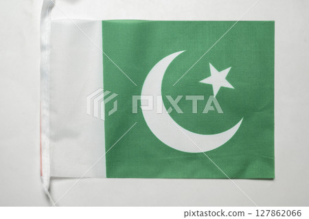 Closeup view of the Pakistan national flag isolated over a white background. Concept of government and nationality 127862066