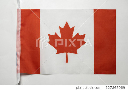 Closeup view of the Canada national flag isolated over a white background. Concept of government and nationality Closeup view of the Canada national flag isolated over a white background. Concept of government and nationality 127862069
