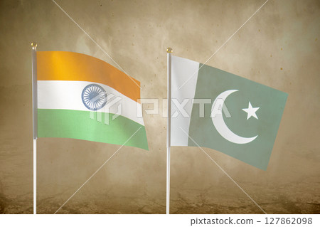 India and Pakistan flags with an inferno landscape background. Pakistan vs India military war conflict. Weapon of a nuclear missile battle India and Pakistan flags with an inferno landscape background. Pakistan vs India military war conflict. Weapon of a nuclear missile battle 127862098