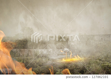 Burning fire on the warland. Inferno landscape, apocalyptic explosion illuminating barren, scorched land. Apocalyptic world war bomb blast 127862101