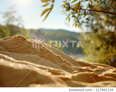 Summer background of beach sand in the foreground and sea in the background, close up sand. AI Generated. 127862134