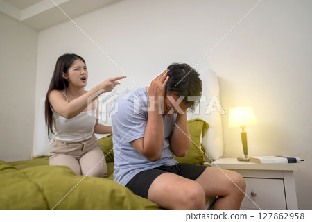 Indonesian southeast asian couple have an argument in the bedroom. Having a crisis and difficulties in a relationship 127862958