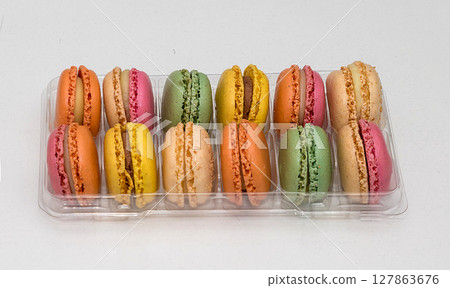 Colourful macarons in plastic box Colourful macarons in plastic box 127863676
