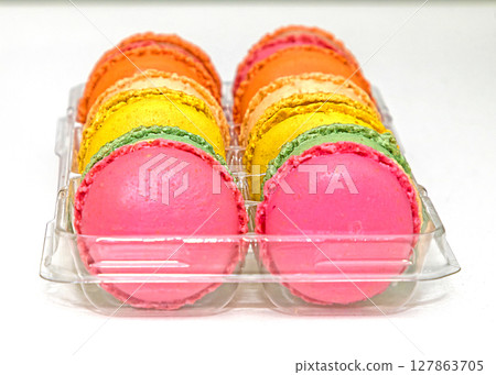 Colourful sweet macarons in plastic box Colourful sweet macarons in plastic box 127863705