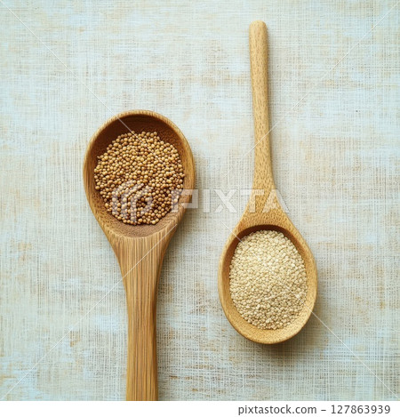 Seeds on spoons highlight natural ingredients 127863939