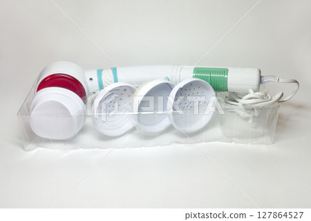 infrared handle massager. device for vibration massage of body and face, with various attachments. in transparent plastic tray 127864527