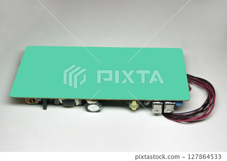 printed circuit board back side, with no components because of the green screen. switch mode power supply, internal module of LED monitor 127864533