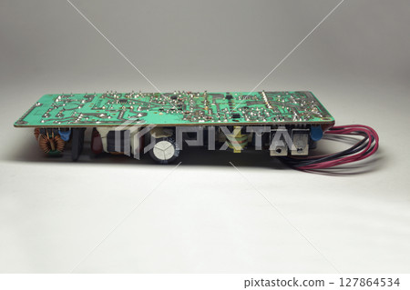 switching mode power supply internal unit of LCD TV, without case, electronic components on PCB, back view 127864534