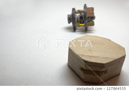 wooden stand, ignition starter switch inners in blured background 127864535