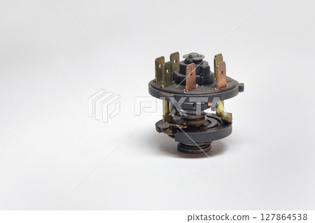 ignition starter switch, key operated, without housing, wire connection terminal set. on white background, with clipping path 127864538