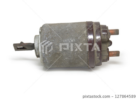 starter solenoid, worn, dismatled from car, with copper screws, on white background, with clipping path 127864589