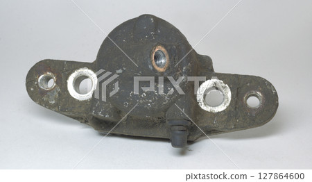brake cylinder of caliper. dirty, dismantled part of car brake system, needs to be replaced 127864600