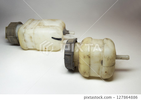 car fluid tanks of brake system and hydraulic clutch, old, worn, dismantled to replace car fluid tanks of brake system and hydraulic clutch, old, worn, dismantled to replace 127864886