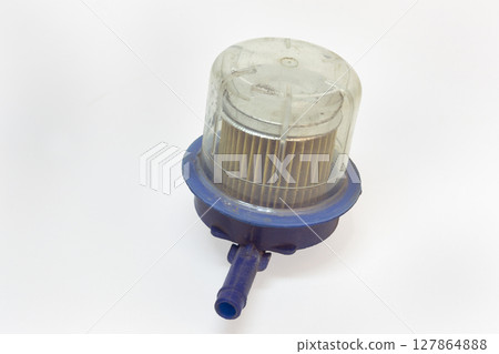 replaceable fuel filter with transparent sump, in plastic housing, old, dismantled for replacing, on white background, with clipping path 127864888