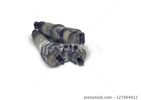 coil on plug coils, piled. showing 3-prong blade male terminal, isolated on white background, with clipping path coil on plug coils, piled. showing 3-prong blade male terminal, isolated on white background, with clipping path 127864912