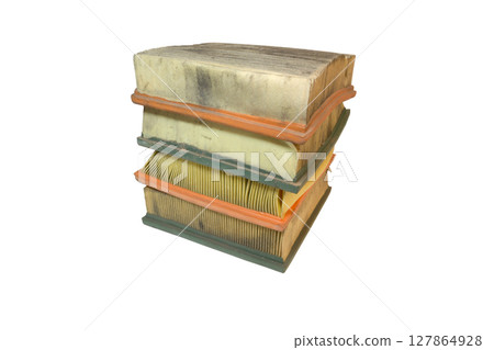 engine air filters neat stack, rectangular, with soft seal on rubber edge. Paper filter, dusty, worn, crumpled when replacing, isolated on white background engine air filters neat stack, rectangular, with soft seal on rubber edge. Paper filter, dusty, worn, crumpled when replacing, isolated on white background 127864928