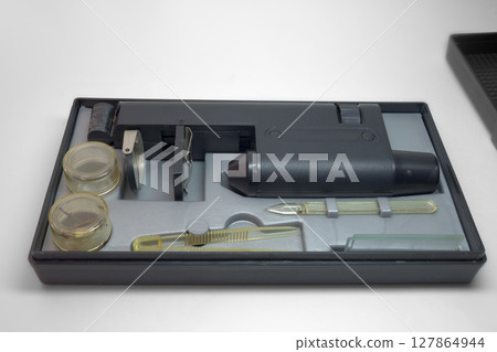 monocular microscope in portable case for storing with tools and asseseories. with clipping path monocular microscope in portable case for storing with tools and asseseories. with clipping path 127864944