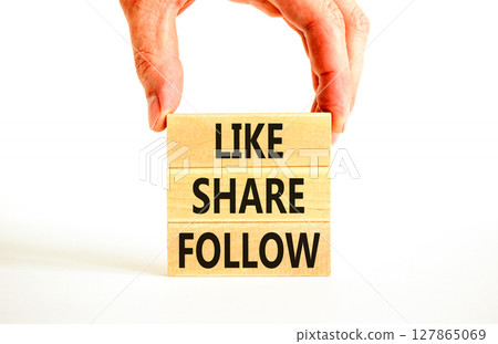 Like share follow symbol. Concept words Like Share Follow on beautiful wooden blocks. Beautiful white background. Businessman hand. Business like share follow concept. Copy space. Like share follow symbol. Concept words Like Share Follow on beautiful wooden blocks. Beautiful white background. Businessman hand. Business like share follow concept. Copy space. 127865069
