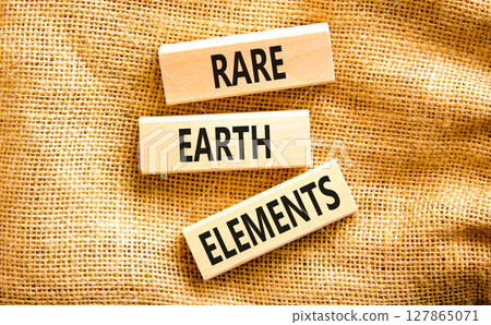 Rare earth elements symbol. Concept words Rare earth elements on beautiful wooden block. Beautiful canvas table canvas background. Business and rare earth elements concept. Copy space. 127865071