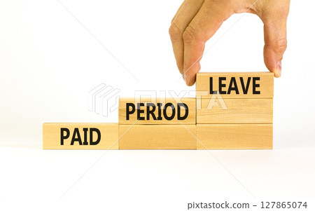 Paid period leave symbol. Concept words Paid period leave on wooden blocks. Beautiful white table white background. Doctor hand. Business medical paid period leave concept. Copy space. Paid period leave symbol. Concept words Paid period leave on wooden blocks. Beautiful white table white background. Doctor hand. Business medical paid period leave concept. Copy space. 127865074